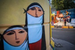 The walls of Baghdad are colored by murals of Iraqi artists