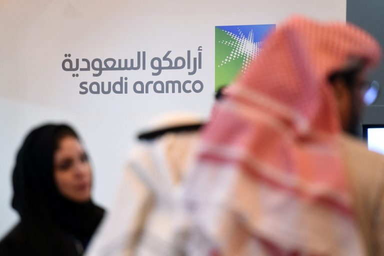 Saudi Aramco share sale rises to $12.35 bn (FILES) In this file photo taken on January 25, 2016 Saudi and Foreign investors stand in front of the logo of Saudi state oil giant Aramco during the 10th Global Competitiveness Forum in the capital Riyadh. - Huthi rebels attacked a facility run by oil company Aramco in Jizan, southern Saudi Arabia, the Saudi-led military coalition fighting the rebels in Yemen said in a statement Saturday.