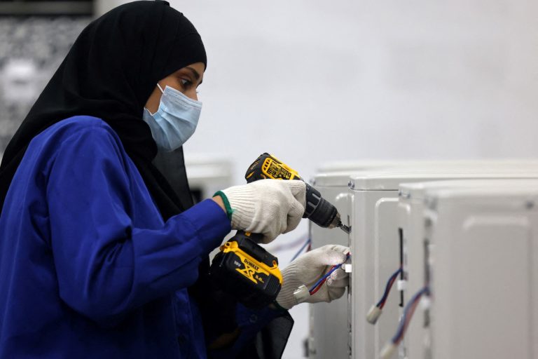 Non-oil investment boosts Saudi GDP A Saudi woman assembles air conditioning units at a factory in Dammam, in Saudi Arabia's eastern province on August 15, 2023. (Photo by Fayez Nureldine / AFP)