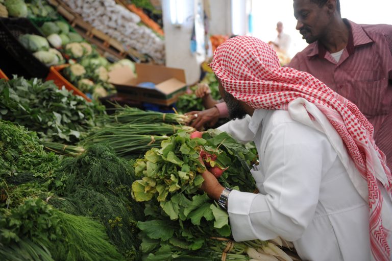 A Saudi man looks at vegetables at a market on April 14, 2015 in the port city of Jizan in the southwest corner of Saudi Arabia. Suaudi Arabia's market of seeds is ripe. AFP PHOTO / FAYEZ NURELDINE (Photo by FAYEZ NURELDINE / AFP)
