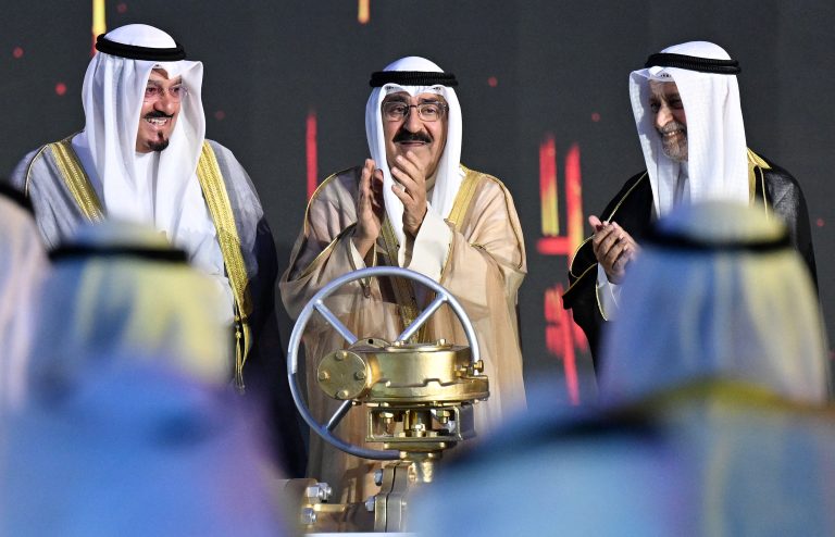 Kuwait's Emir Sheikh Meshal al-Ahmed al-Sabah (C) turns a symbolic equipment during the opening of the Al-Zour oil Refinery - whose refining capacity reached 615,000 - on May 29, 2024, in al-Zour, south of Kuwait City. (Photo by YASSER AL-ZAYYAT / AFP)