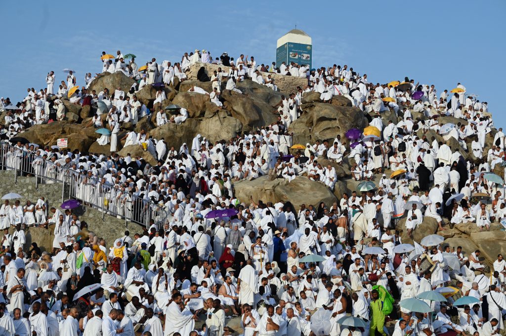 Muslim pilgrims crowd Saudi Arabia's Mount Arafat,also known as Jabal al-Rahma or Mount of Mercy, during the climax of the Hajj pilgrimage on June 27, 2023. The ritual is the high point of the annual pilgrimage, one of the five pillars of Islam, that officials say could be the biggest on record after three years of Covid restrictions. (Photo by Sajjad HUSSAIN / AFP)