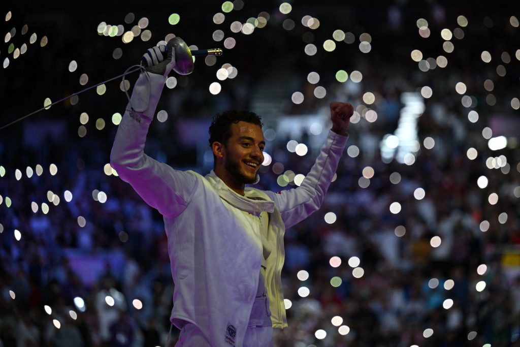 Egypt's Mohamed Elsayed celebrates after winning against Hungary's Tibor Andrasfi in the men's epee individual bronze medal bout during the Paris 2024 Olympics at the Grand Palais in Paris, on July 28, 2024. (Photo by Fabrice COFFRINI / AFP)