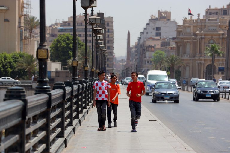 People walking in Cairo: Prospects are better for the economy