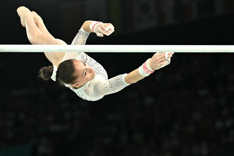 Algeria's Kaylia Nemour competes in the artistic gymnastics women's uneven bars final during the Paris 2024 Olympic Games at the Bercy Arena in Paris, on August 4, 2024. (Photo by Lionel BONAVENTURE / AFP)