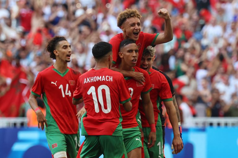 Olympics: Arab football teams compete for bronze Morocco's forward #09 Soufiane Rahimi (2ndR) celebrates with teammates after scoring his team's first goal during the men's semi-final football match between Morocco and Spain of the Paris 2024 Olympic Games at the Marseille Stadium in Marseille on August 5, 2024. (Photo by Pascal GUYOT / AFP)