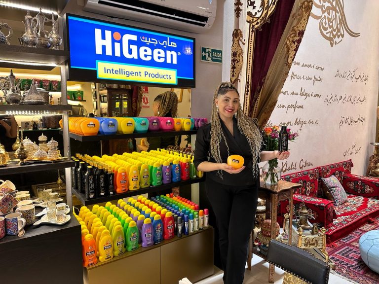 Sales representative presents HiGeen products displayed on a stand at the Al Ward store