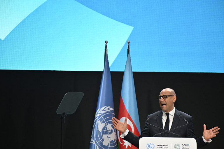 UN climate chief Simon Stiell delivers a speech during the opening of the 2024 COP29 in Baku