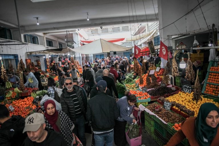 Tunisians walk through a market in Ariana district, near capital Tunis: Food prices pushed up inflation