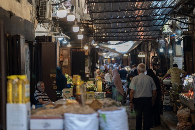 People shop at the al-Atareen old market in the northern Lebanese city of Tripoli on July 27, 2024. (Photo by Khaled DESOUKI / AFP)