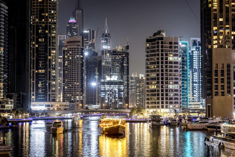 A boat sails at the Dubai Marina in Dubai on December 13, 2024. (Photo by FADEL SENNA / AFP)