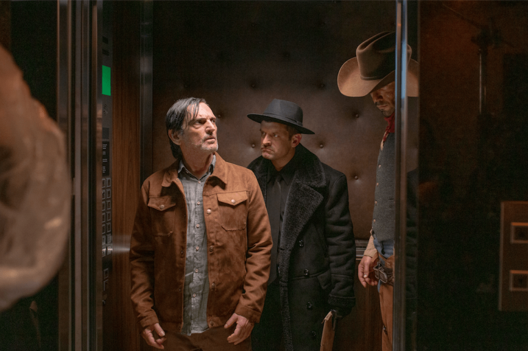 In the comedy Jesus Kid, actor Paulo Miklos (L) plays a writer facing financial and creative struggles