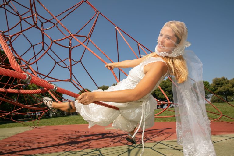 The artist pictured in one of her creations, the photo performance Mariage Blanc (Convenience Marriage)