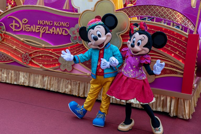 Mickey and Minnie Mouse pose in Lunar New Year attire in front of the Hong Kong Disneyland Float during a media preview in Hong Kong, China, on January 27, 2025. (Photo by Vernon Yuen/NurPhoto) (Photo by Vernon Yuen / NurPhoto / NurPhoto via AFP)