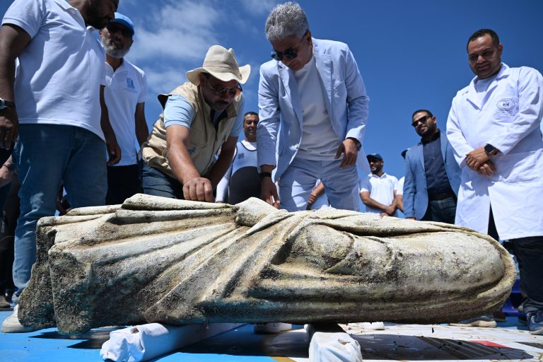 Brazil-Arab Gallery #11 Egypt's Minister of Tourism and Antiquities Sherif Fathi inspects a recovered artifact at Abu Qir bay in Alexandria on August 21, 2025, as part of an event organized by the Ministry of Tourism and Antiquities to recover sunken antiquities. (Photo by Khaled DESOUKI / AFP)