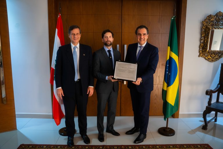 Alongside Mourad (L), Dib (R) presented George Al Jallad (center) with an appreciation plaque for his work at the embassy