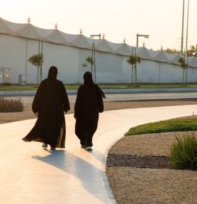 Women wearing hijab walking in streets of Abu Dhabi, United Arab Emirates
