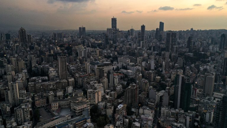 IMF urges Lebanon to implement reforms for growth This picture taken on October 11, 2021 shows a sunset aerial view Lebanon's capital Beirut, with buildings in darkness during a power outage. (Photo by AFP)