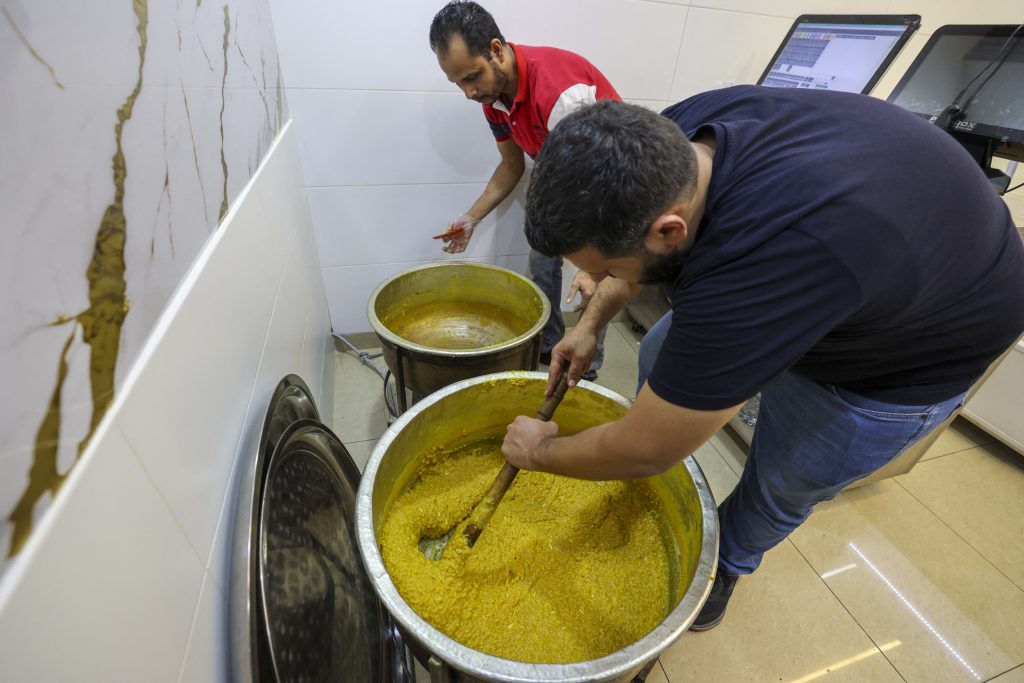 Man prepares sesame sweets in Lebanon: Country is a consumer