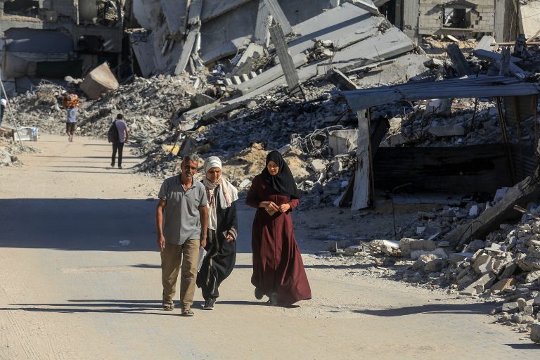 KHAN YUNIS, GAZA - OCTOBER 14: Destroyed buildings and rubble are seen as displaced Palestinians return to the Akkad region in Khan Yunis, Gaza following the withdrawal of Israeli forces on October 14, 2025. After the ceasefire takes effect, civilians discover widespread destruction, with entire residential blocks and high-rise buildings reduced to ruins. Abed Rahim Khatib / Anadolu (Photo by Abed Rahim Khatib / Anadolu via AFP)