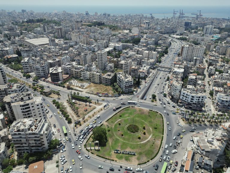 Syrian company holds tender to increase efficiency A view of a traffic roundabout in central Latakia, Syria on June 12, 2025. The citys road network converges near the coast, forming one of the busiest urban intersections in the province. (Photo by Omar Albaw / Middle East Images via AFP)