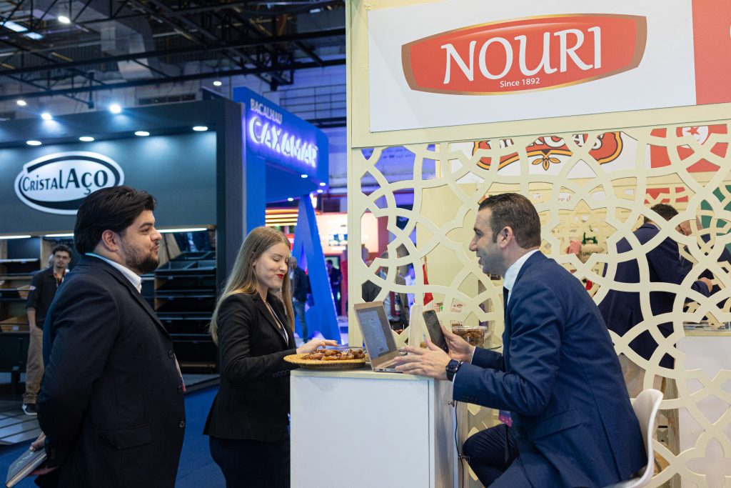 Boumaiza speaks with visitors at Nouri booth